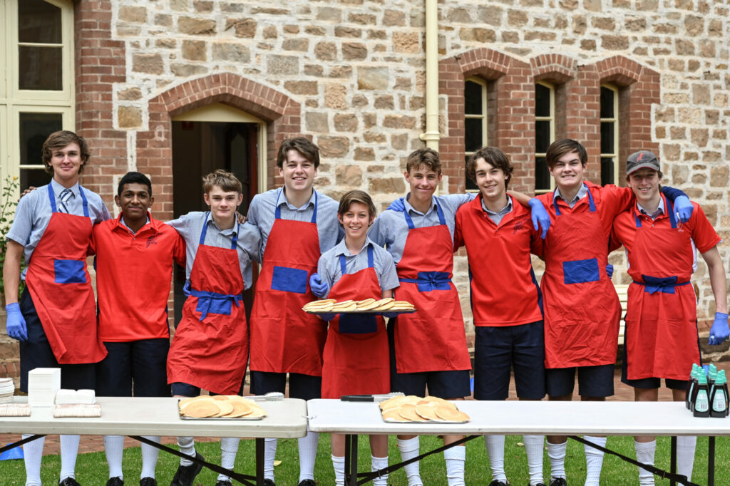 Students cooking pancakes for Shrove Tuesday